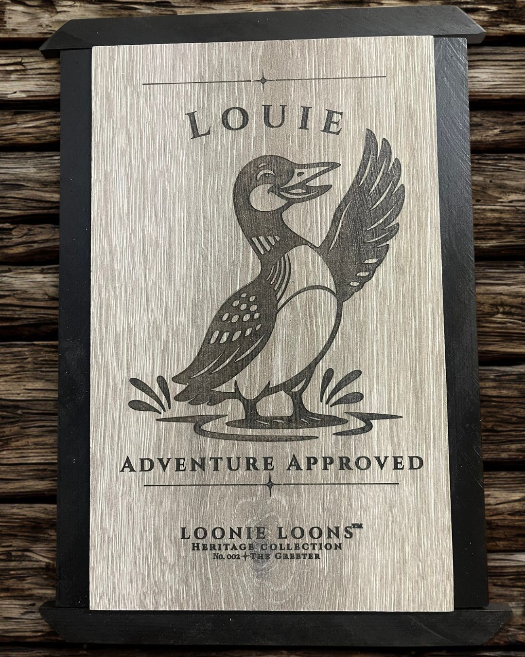 Rustic Northwoods cabin wall art featuring Louie the Greeter. Engraved wood loon sign perfect for lake house and lodge-style decor.